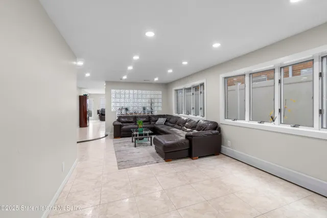 a living room with furniture and windows