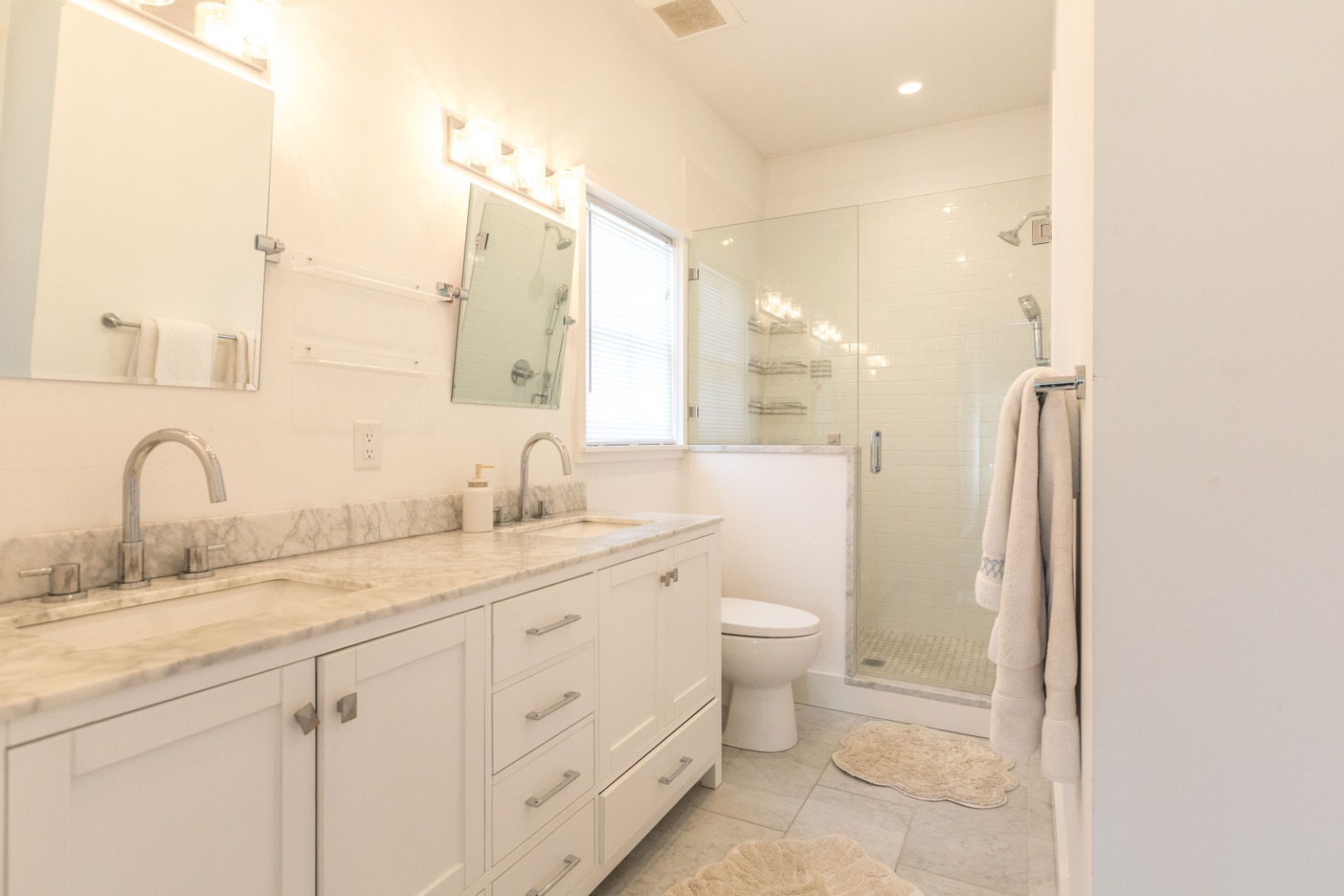 2 Wood Lily Road Nantucket, MA 02554 - Photo 16 of 38 a bathroom with a granite countertop toilet sink and a mirror