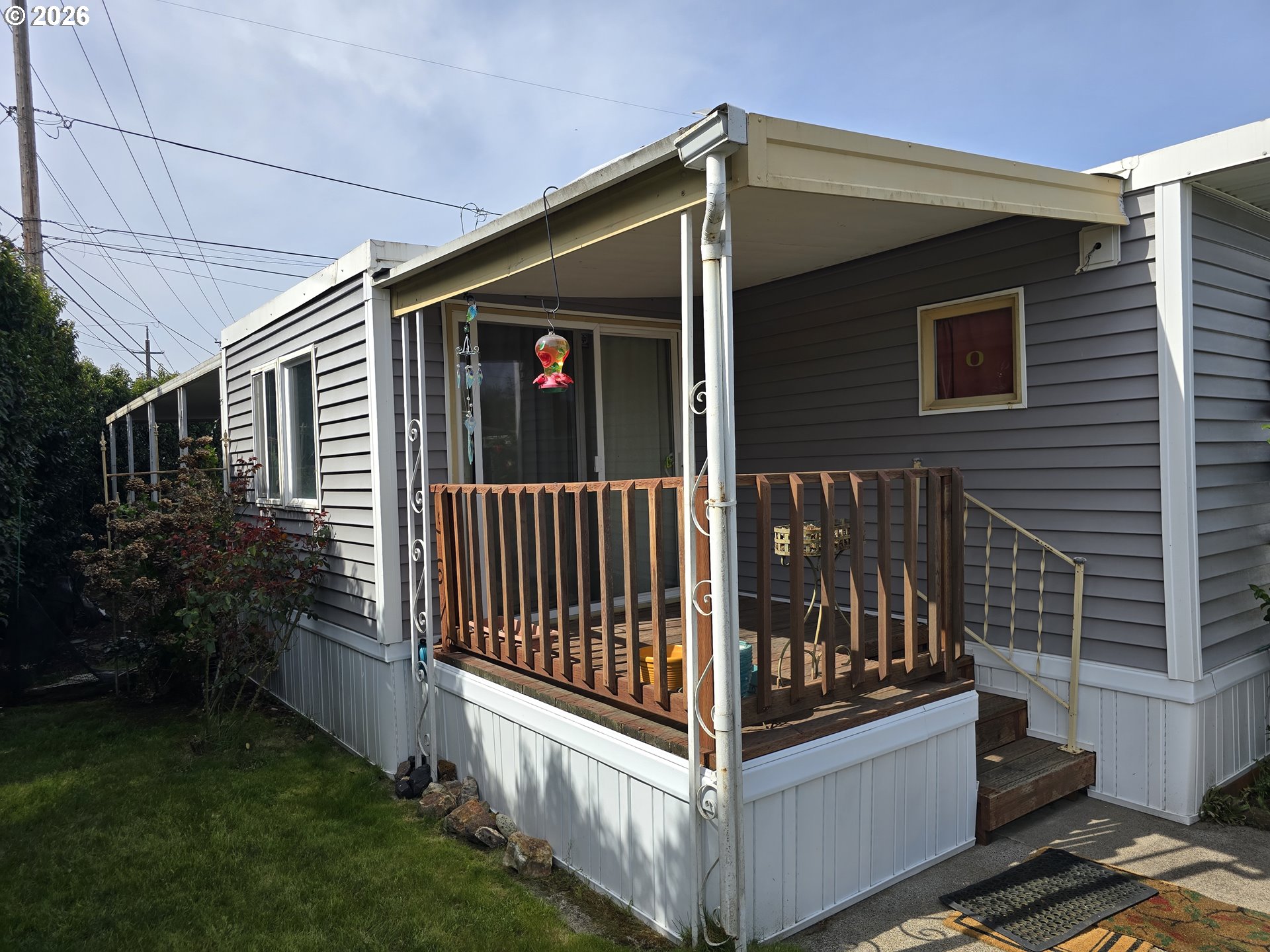 501 Division Avenue, Unit 28 Eugene, OR 97404 - Photo 2 of 17 a view of a house with a small yard and wooden fence