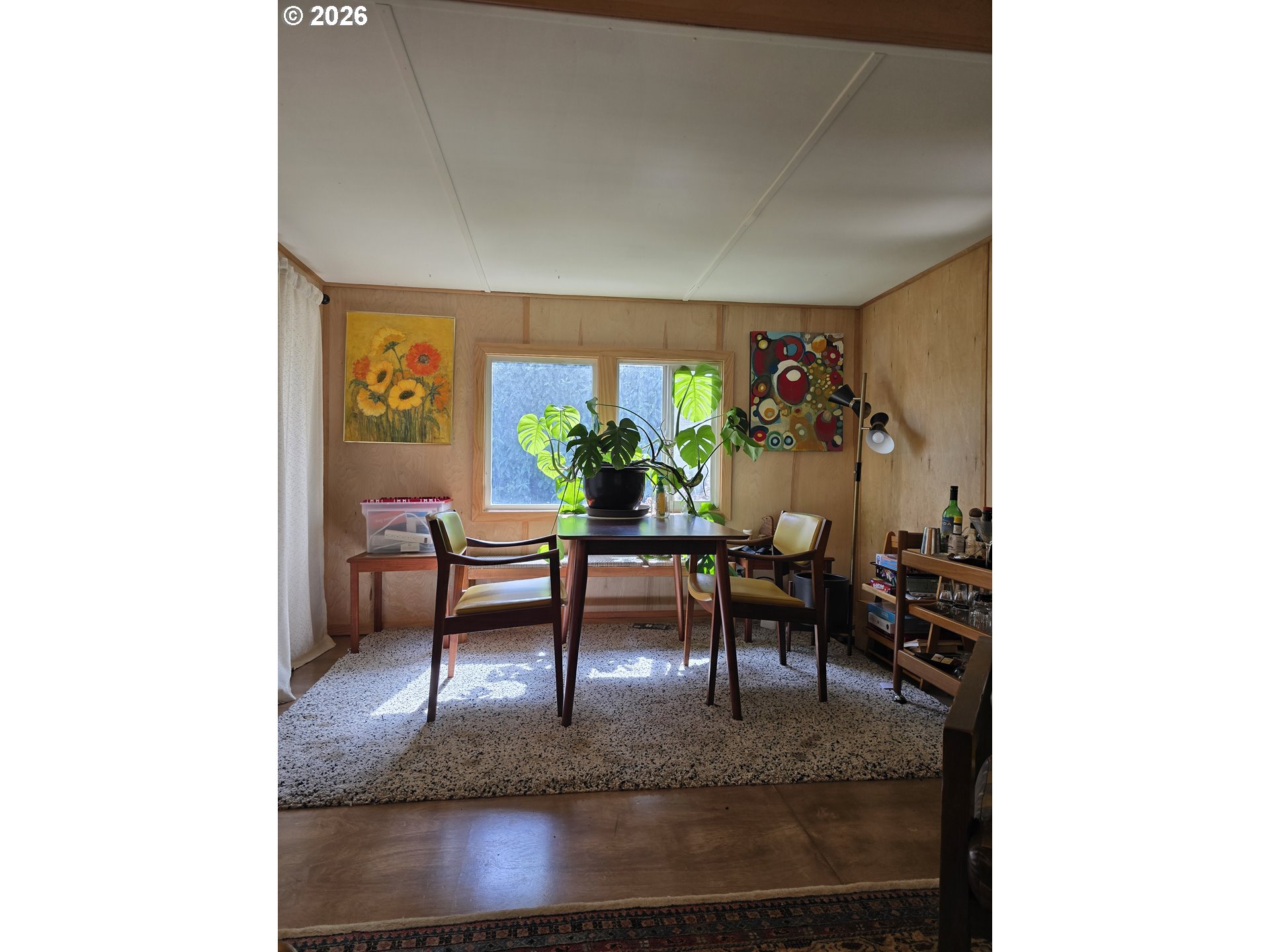 501 Division Avenue, Unit 28 Eugene, OR 97404 - Photo 7 of 17 a living room with furniture and a table