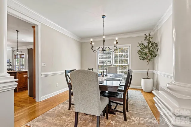 an aerial view of residential houses with yard