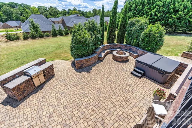 a view of a patio with a table and chairs and wooden floor