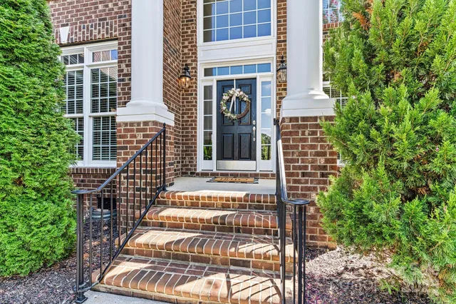 a living room with fireplace furniture and a wooden floor
