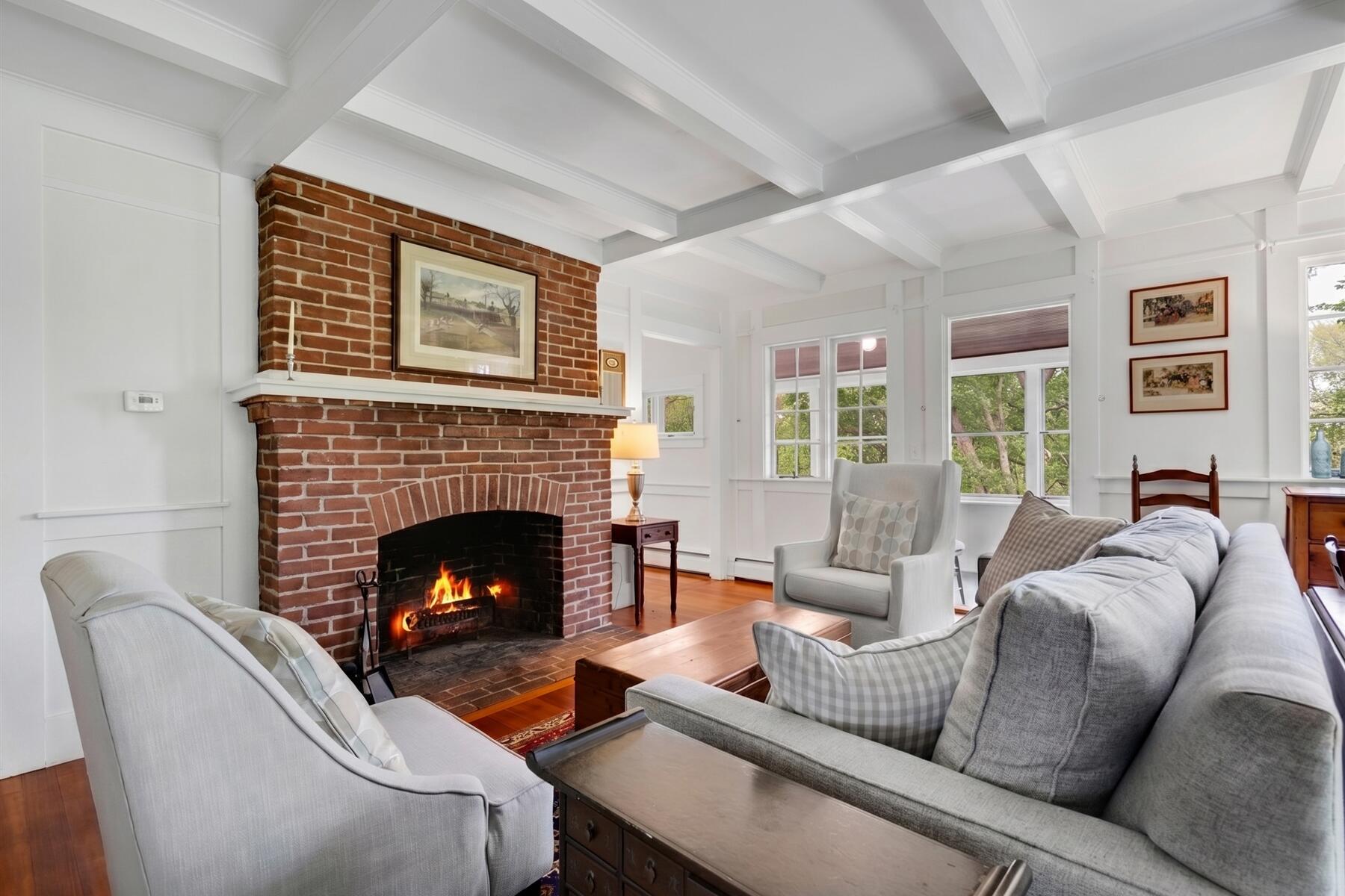 21 Quaker Road East Sandwich, MA 02537 - Photo 13 of 43 a living room with furniture and a fireplace