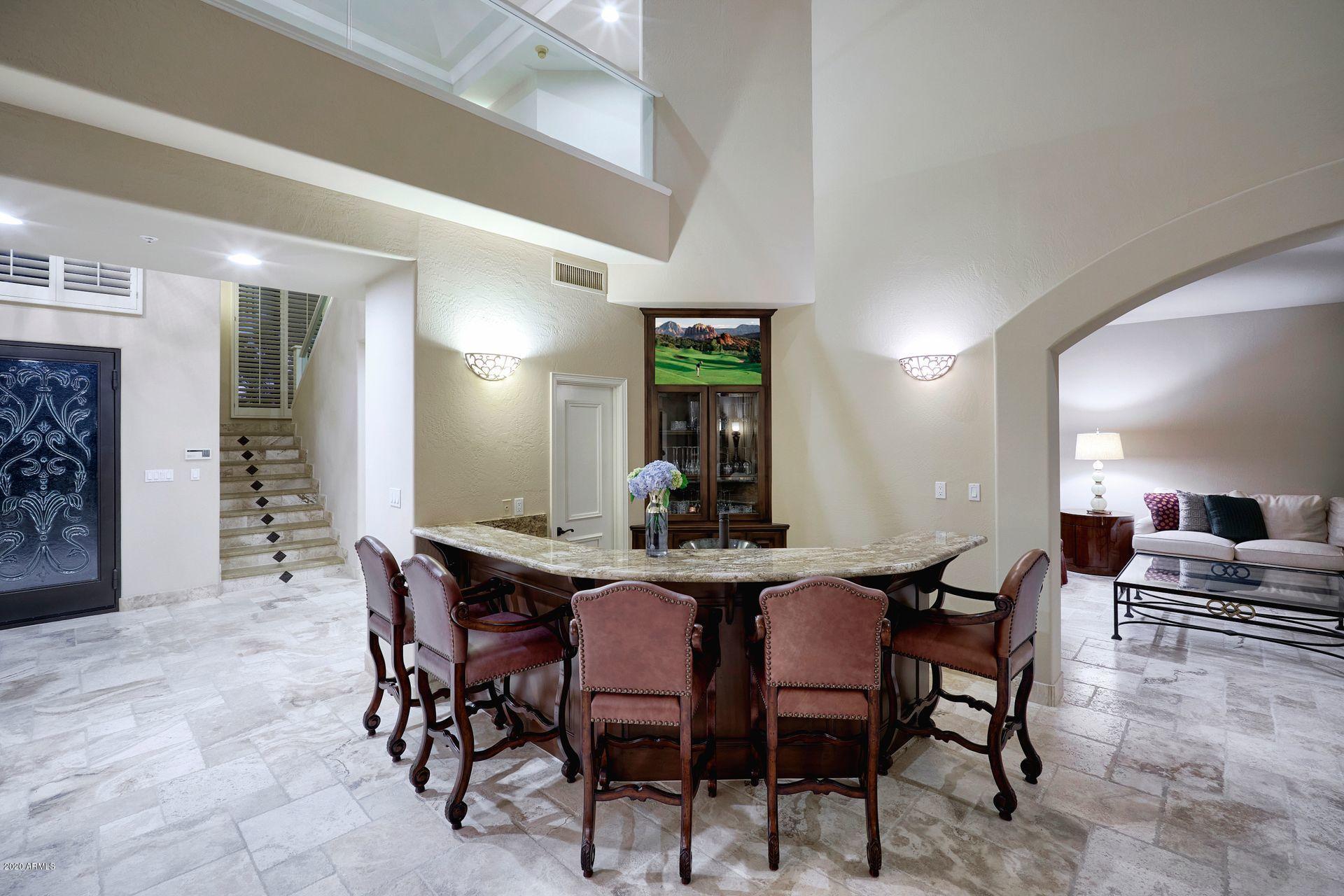 7323 East Gainey Ranch Road, Unit 4 Scottsdale, AZ 85258 - Photo 11 of 56 a view of a dining room with furniture
