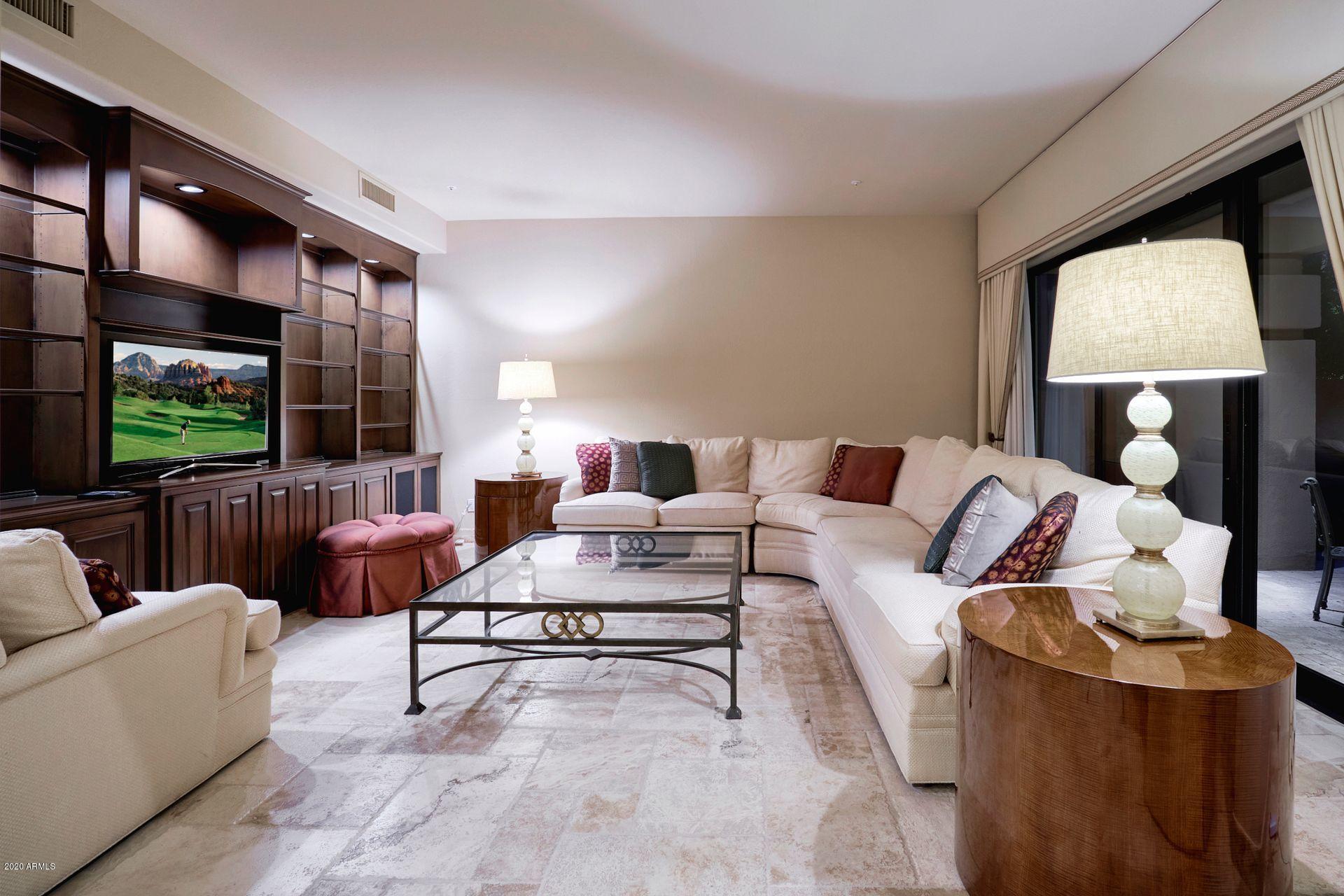 7323 East Gainey Ranch Road, Unit 4 Scottsdale, AZ 85258 - Photo 13 of 56 a living room with furniture and a flat screen tv
