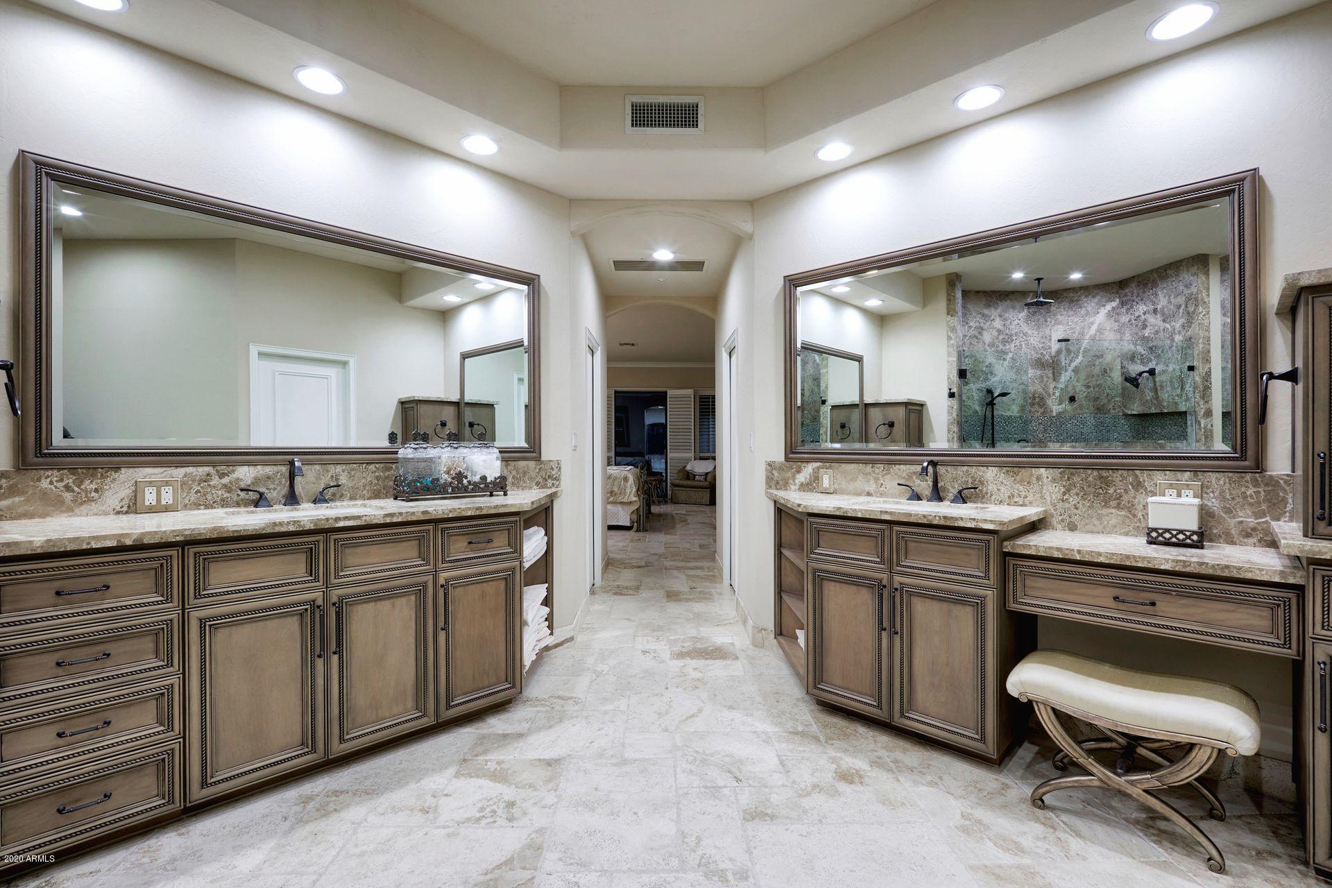 7323 East Gainey Ranch Road, Unit 4 Scottsdale, AZ 85258 - Photo 35 of 56 a large bathroom with a large vanity and sink