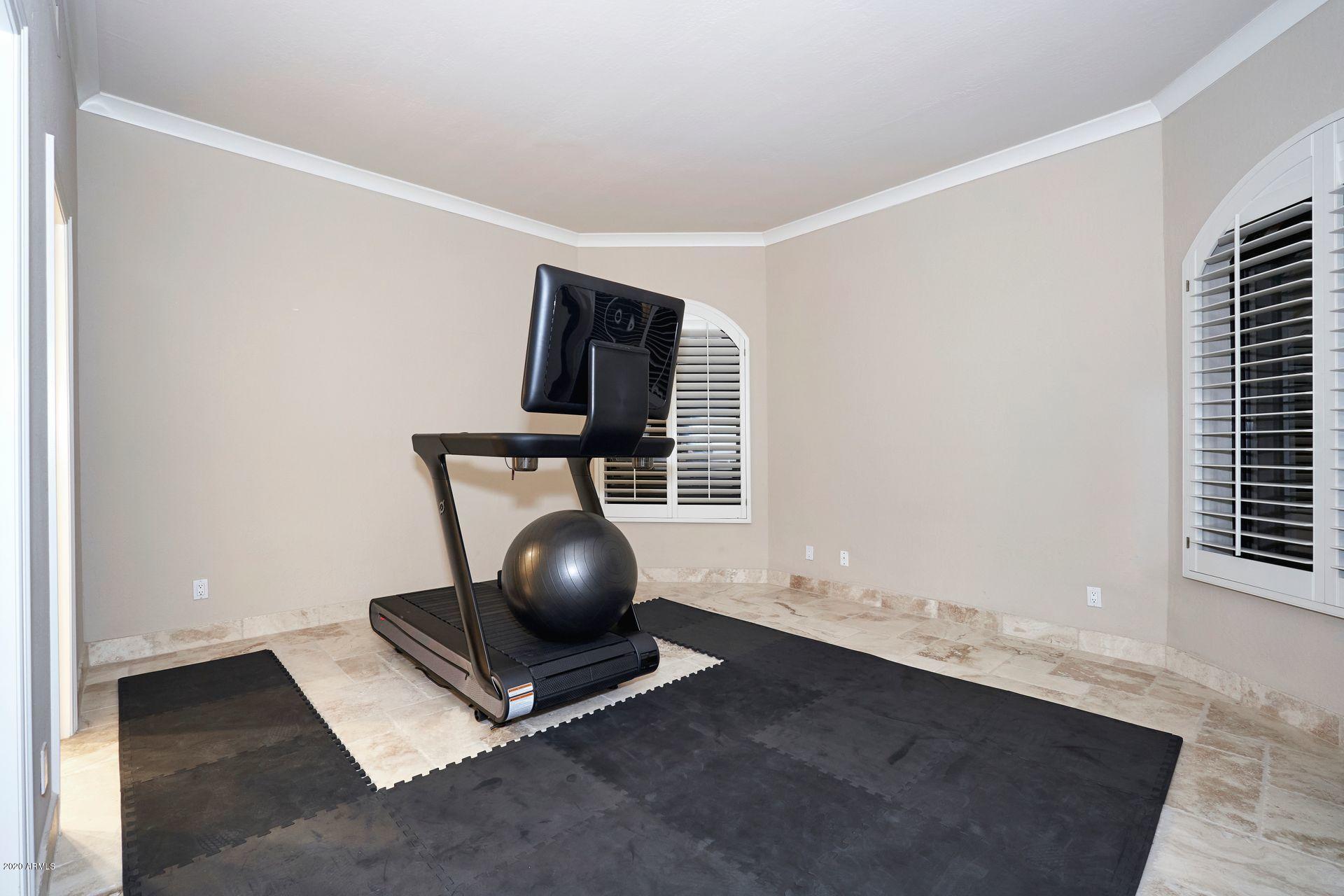7323 East Gainey Ranch Road, Unit 4 Scottsdale, AZ 85258 - Photo 37 of 56 a room with chair and table