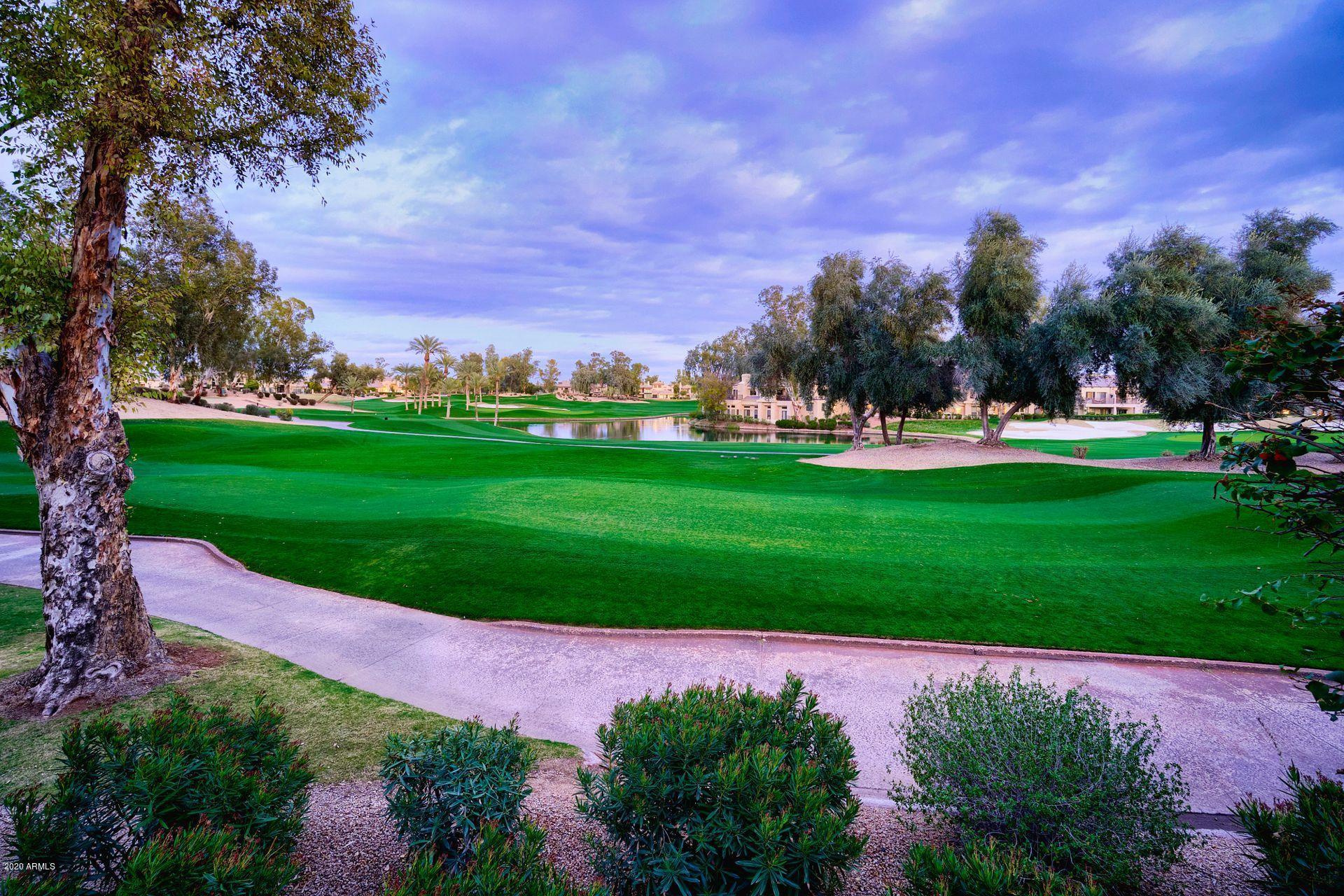 7323 East Gainey Ranch Road, Unit 4 Scottsdale, AZ 85258 - Photo 47 of 56 a view of a golf course with a garden