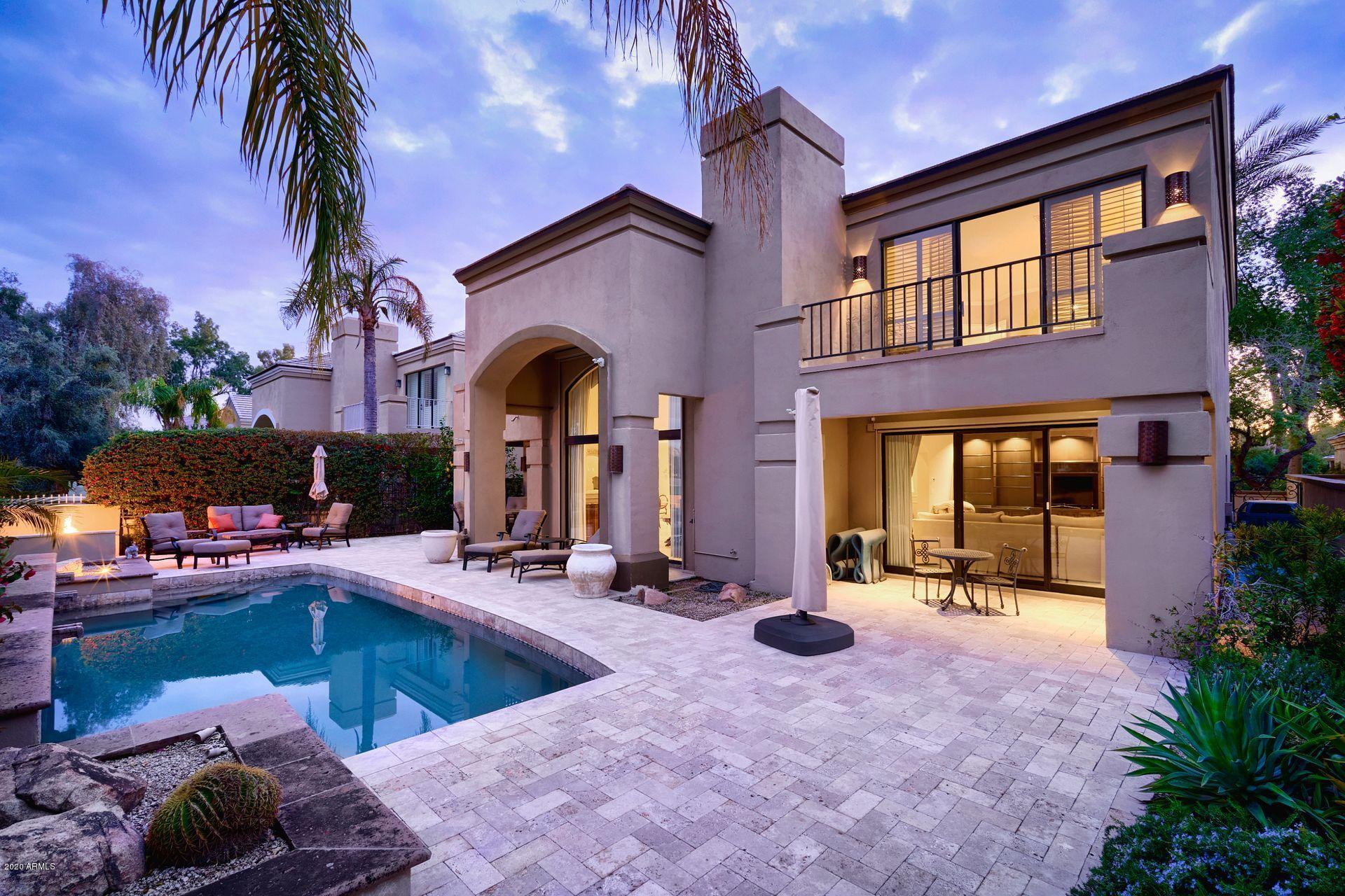 7323 East Gainey Ranch Road, Unit 4 Scottsdale, AZ 85258 - Photo 49 of 56 a view of a swimming pool with outdoor seating