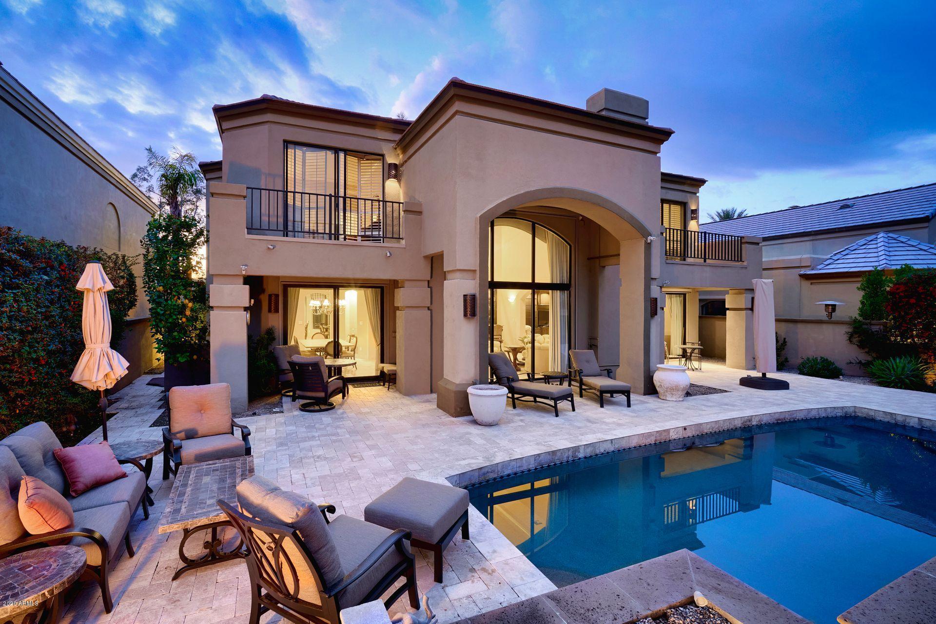7323 East Gainey Ranch Road, Unit 4 Scottsdale, AZ 85258 - Photo 50 of 56 a view of a house with swimming pool and sitting area