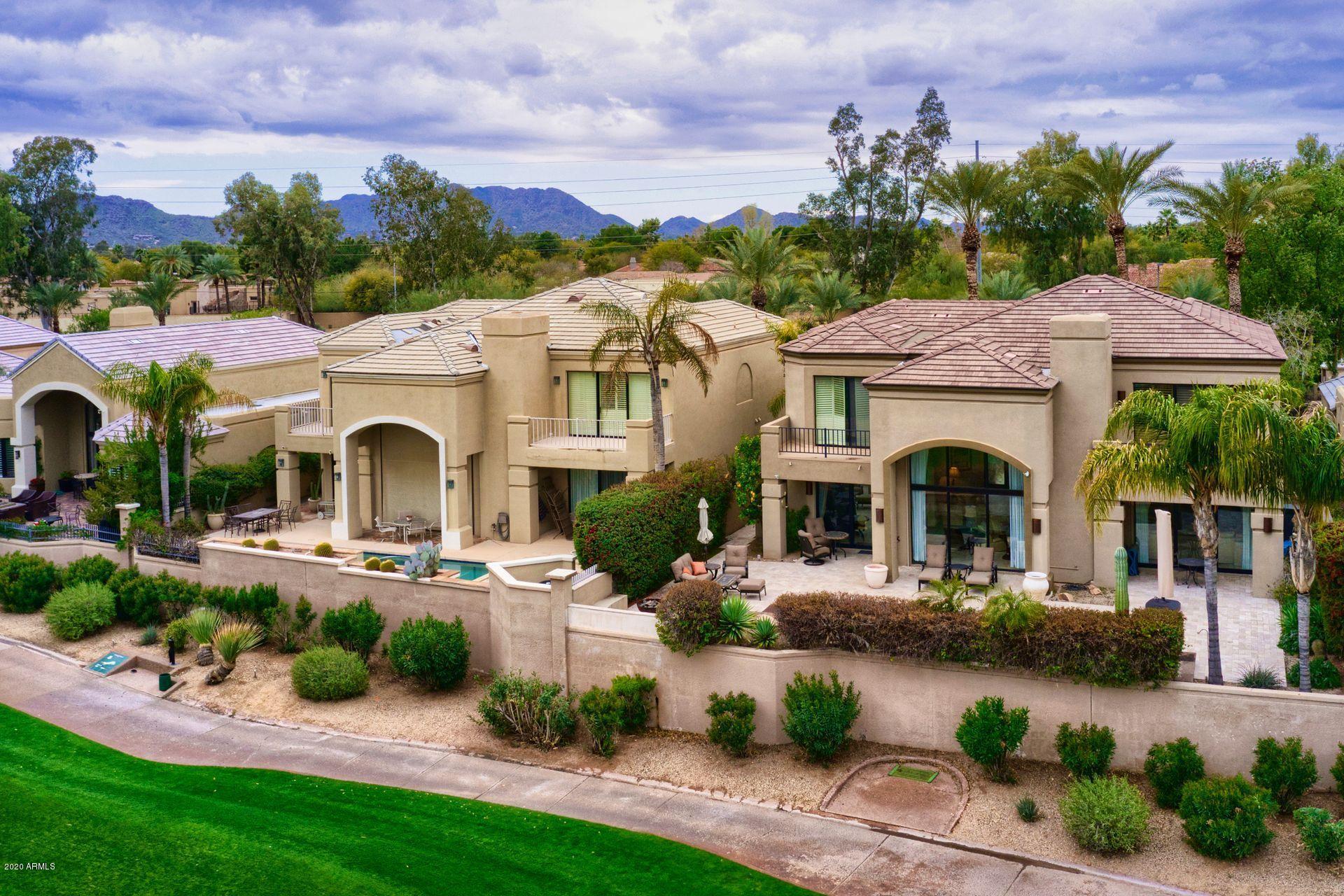 7323 East Gainey Ranch Road, Unit 4 Scottsdale, AZ 85258 - Photo 53 of 56 a front view of a house with garden