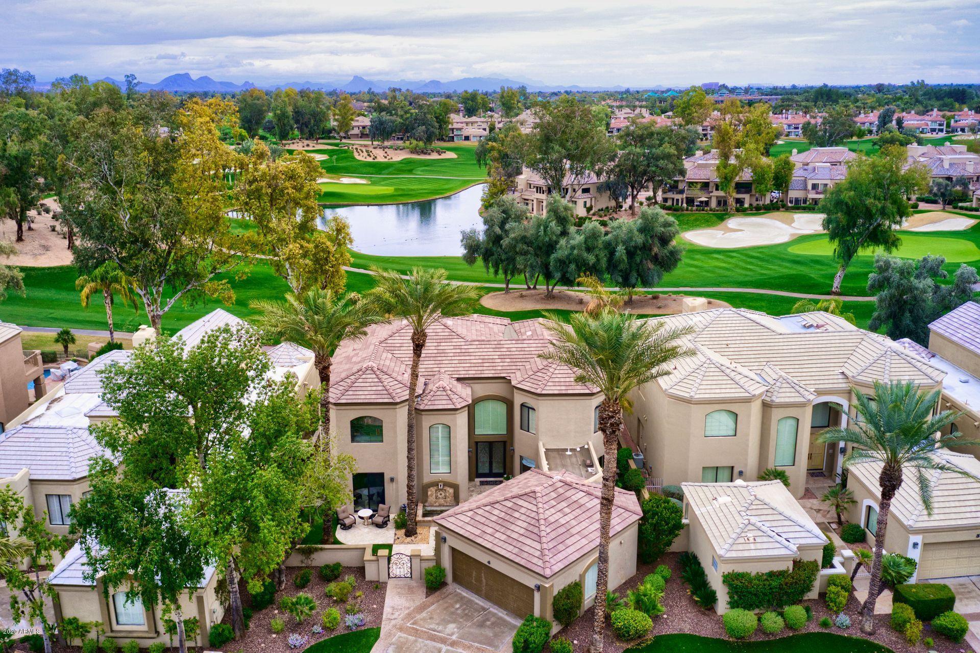 7323 East Gainey Ranch Road, Unit 4 Scottsdale, AZ 85258 - Photo 56 of 56 a view of house with a garden