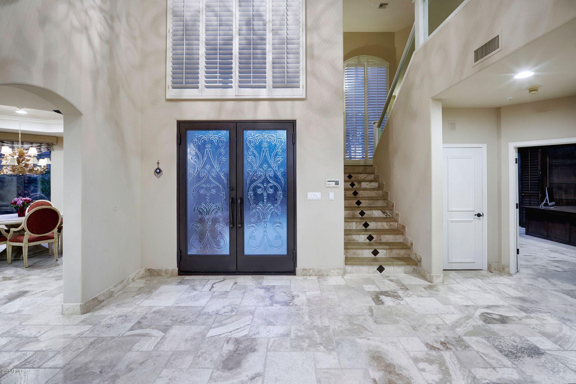 7323 East Gainey Ranch Road, Unit 4 Scottsdale, AZ 85258 - Photo 7 of 56 a view of an entryway with staircase