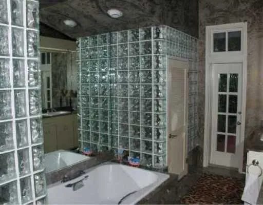 a bathroom with a shower and a sink