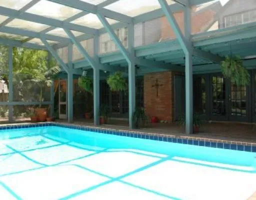 a view of backyard with porch and outdoor seating
