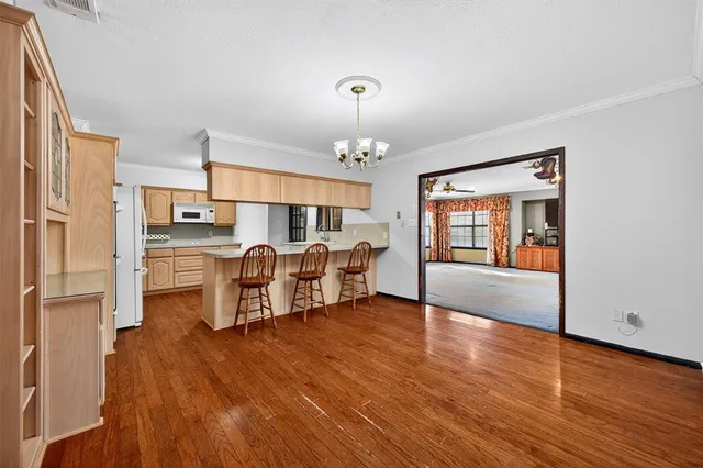 a view of a livingroom with a ceiling fan and window