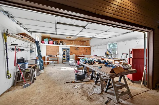 a living room with lots of furniture and gym equipment
