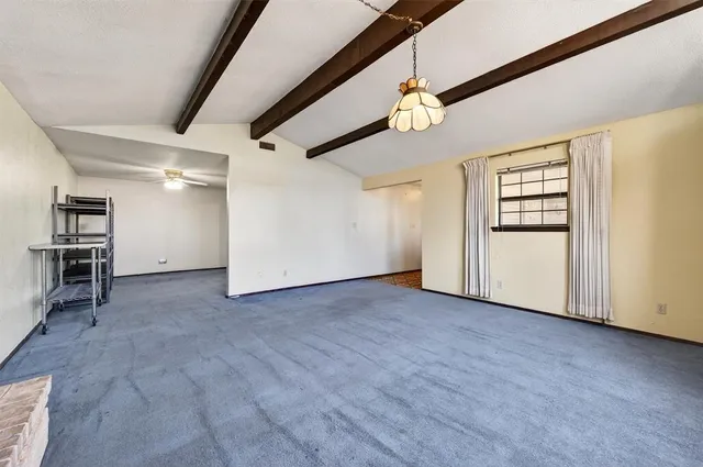 a dining room with stainless steel appliances granite countertop a kitchen island a table and chairs
