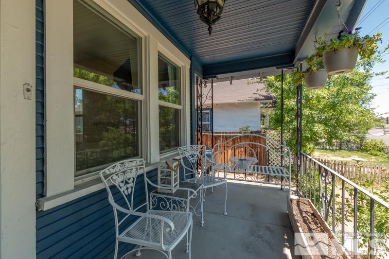 489 East 9th Street Reno, NV 89512 - Photo 2 of 19 a view of a balcony with table and chairs and wooden floor