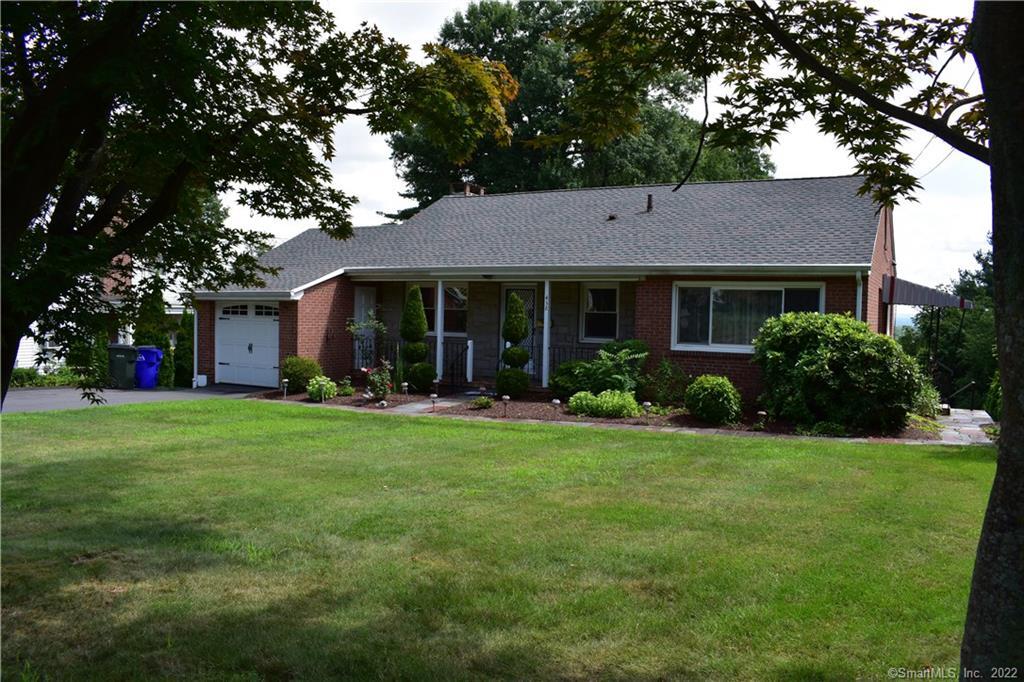 a view of a house with a yard
