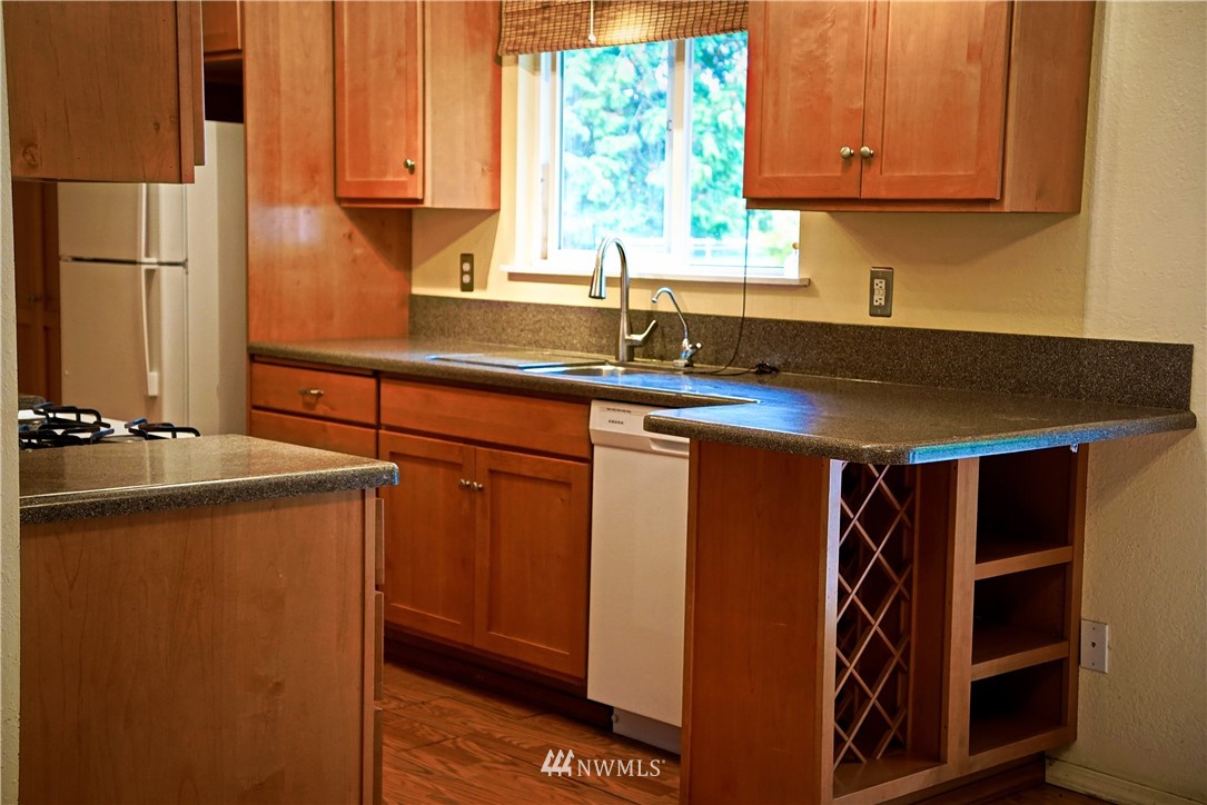 1746 Trigg Road Ferndale, WA 98248 - Photo 8 of 28 a kitchen with stainless steel appliances a sink a stove and a refrigerator
