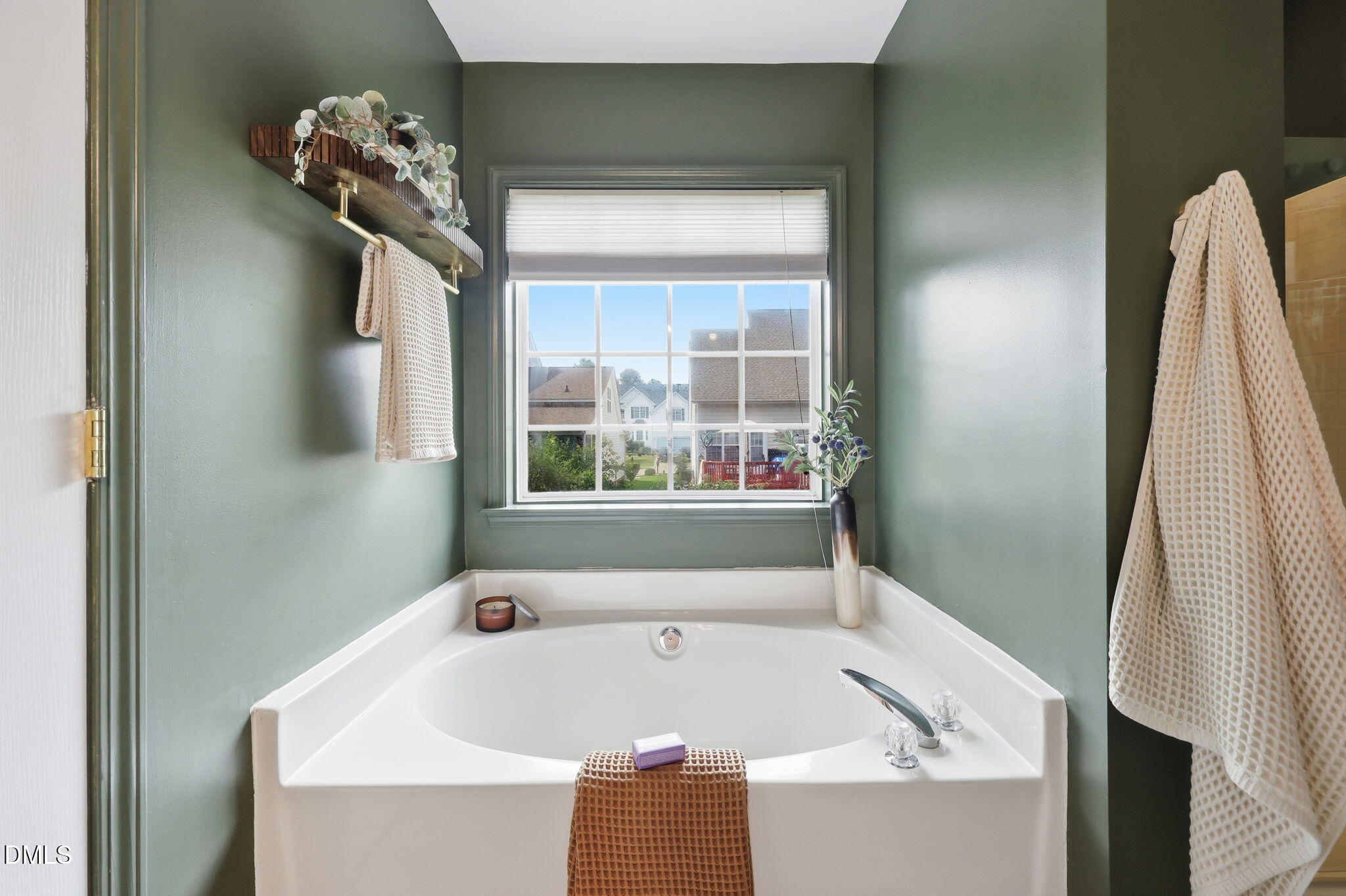 5629 Enoree Lane Raleigh, NC 27616 - Photo 24 of 38 a bath tub sitting in a bathroom next to a window