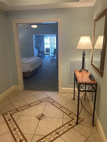 a room with a table tennis table and chair