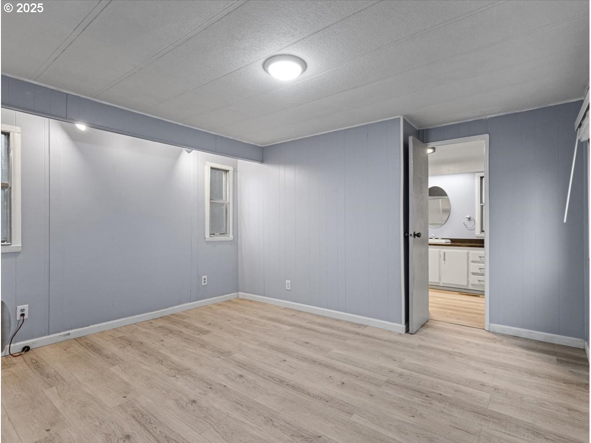 6610 Northwest Whitney Road, Unit 138 Vancouver, WA 98665 - Photo 16 of 34 a view of empty room with wooden floor
