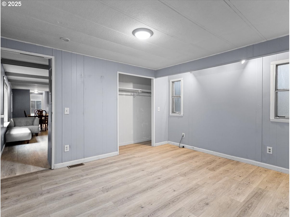 6610 Northwest Whitney Road, Unit 138 Vancouver, WA 98665 - Photo 17 of 34 a bedroom with a bed and a view of livingroom