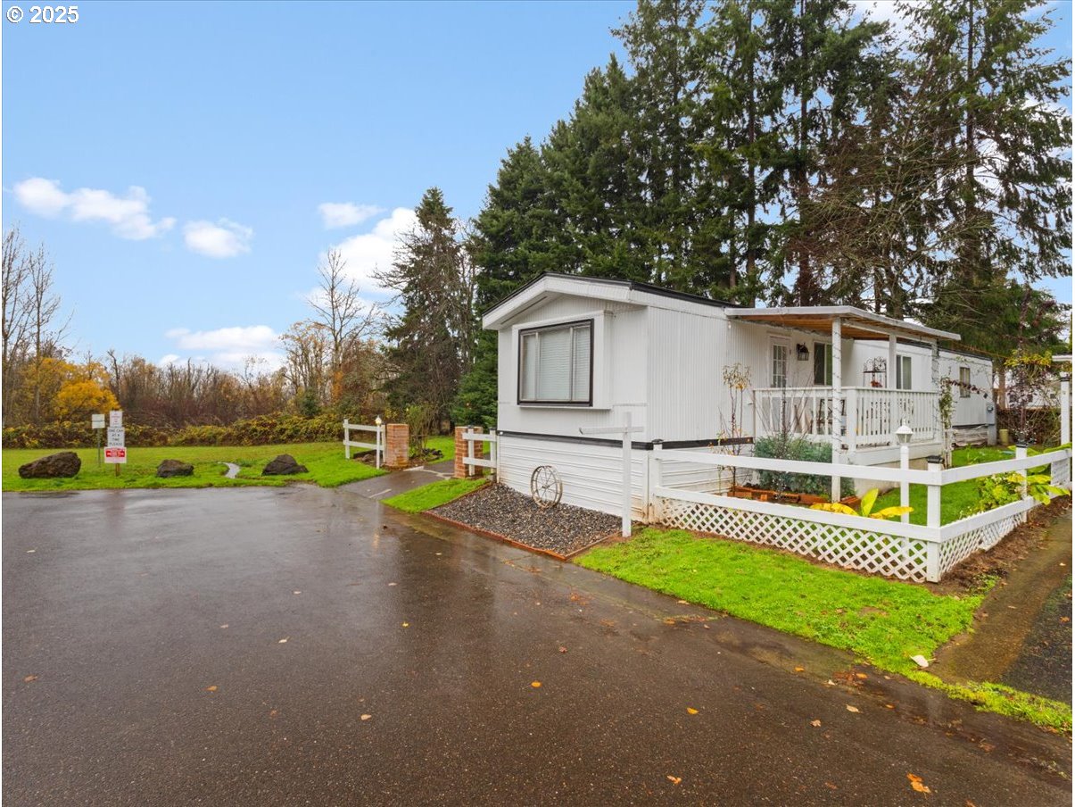 6610 Northwest Whitney Road, Unit 138 Vancouver, WA 98665 - Photo 2 of 34 a view of a house with pool and yard