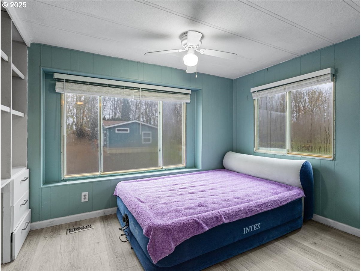 6610 Northwest Whitney Road, Unit 138 Vancouver, WA 98665 - Photo 24 of 34 a bedroom with a large bed and a window