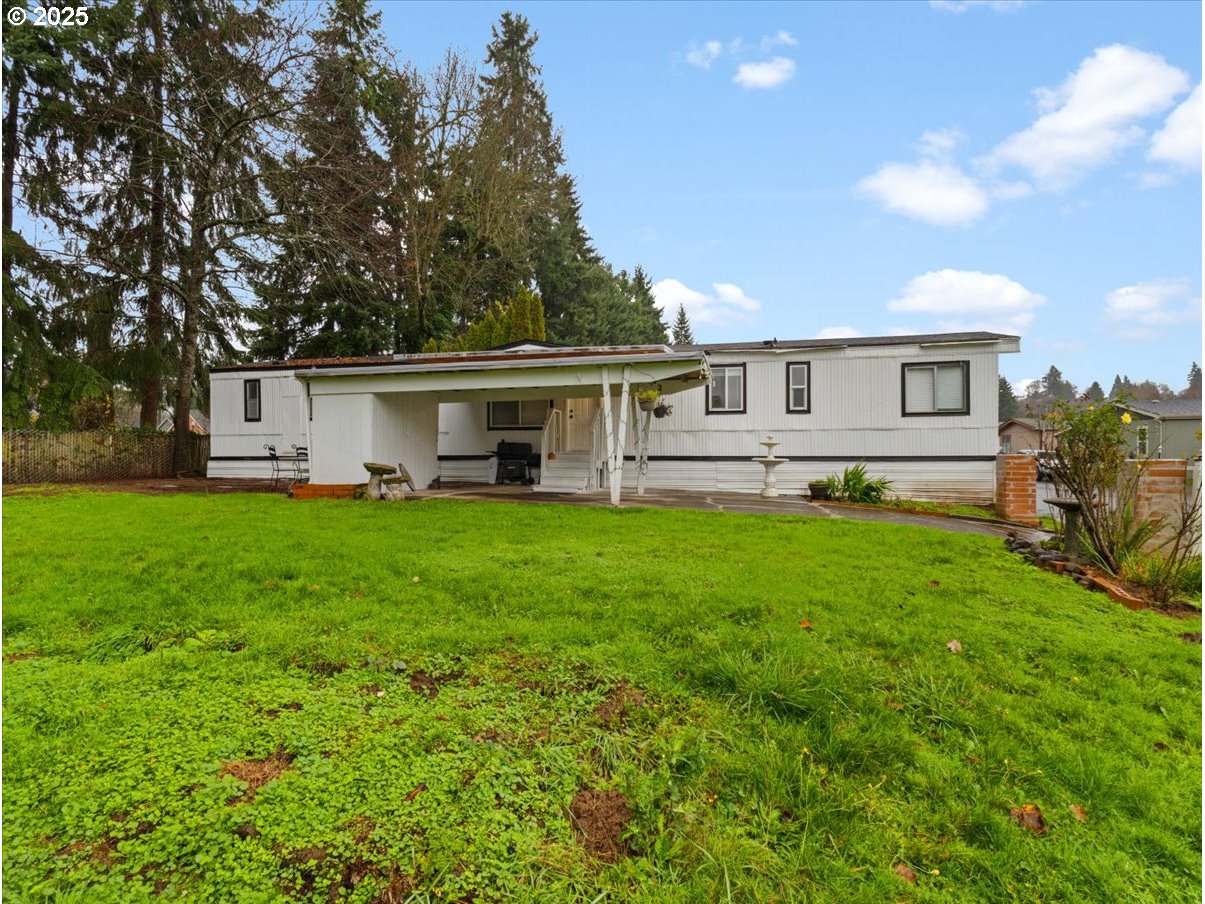 6610 Northwest Whitney Road, Unit 138 Vancouver, WA 98665 - Photo 29 of 34 a front view of house with yard and green space