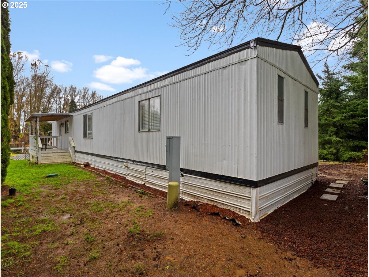 6610 Northwest Whitney Road, Unit 138 Vancouver, WA 98665 - Photo 31 of 34 a house with trees in the background