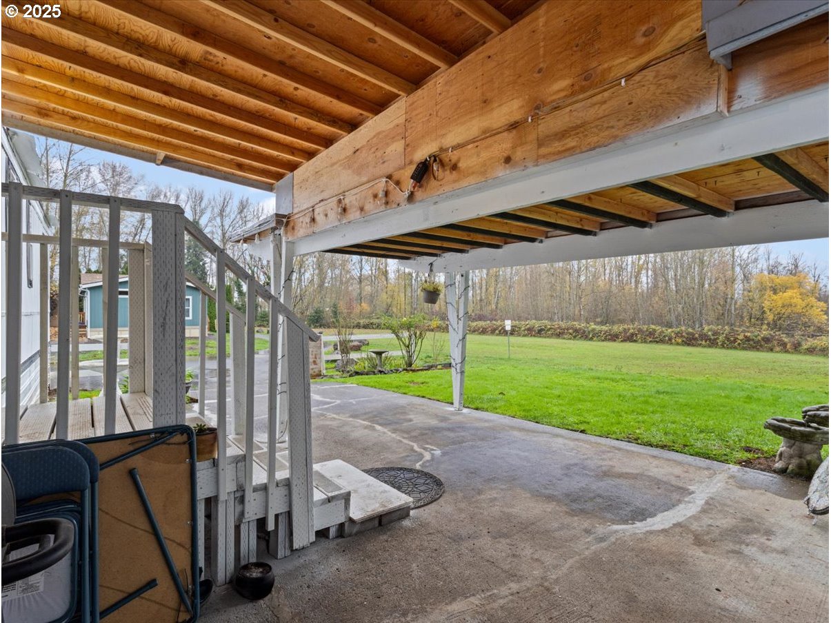 6610 Northwest Whitney Road, Unit 138 Vancouver, WA 98665 - Photo 4 of 34 a view of yard with porch and wooden fence