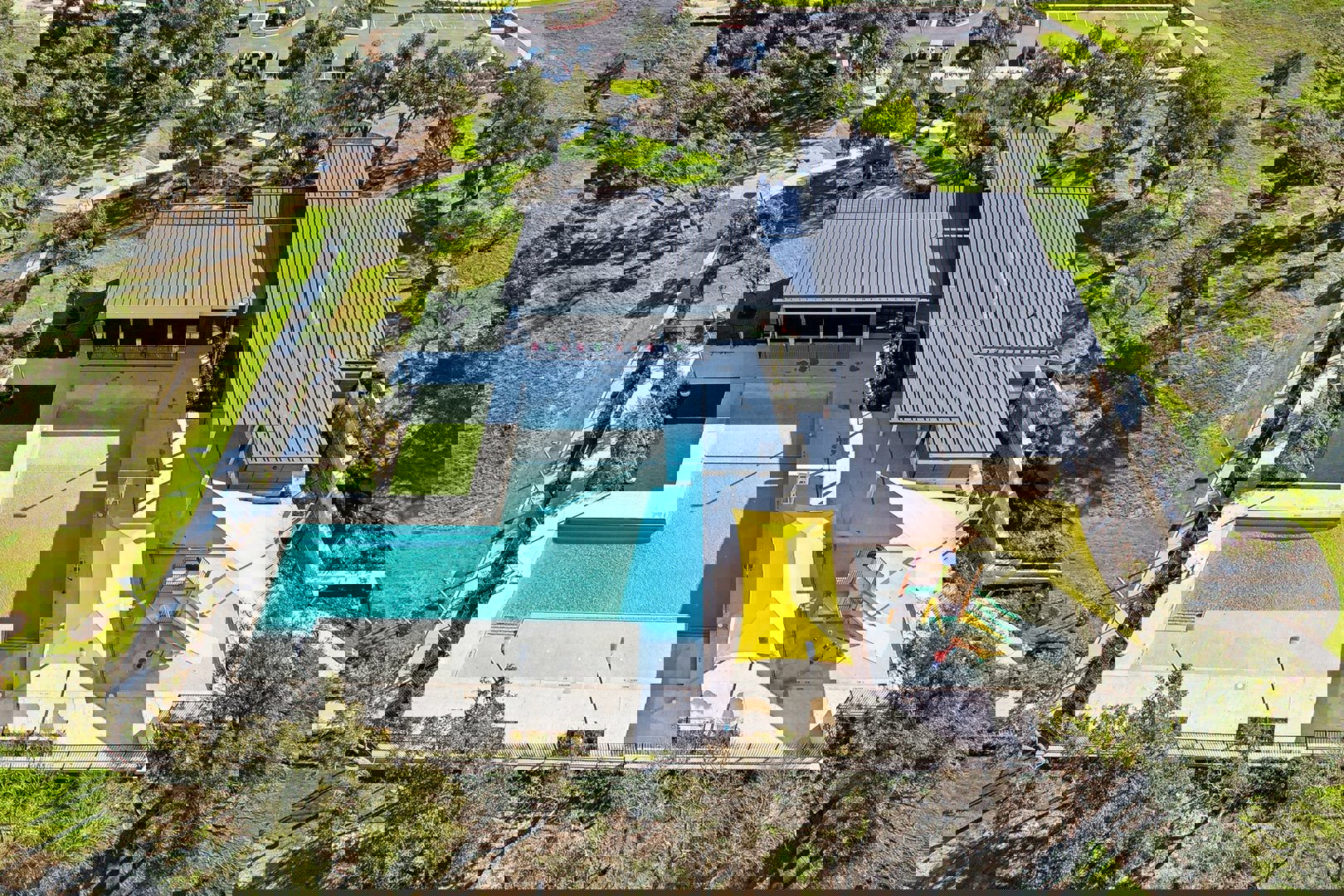 233 Firefox Way Jarrell, TX 76537 - Photo 2 of 6 an aerial view of a house with swimming pool and large trees