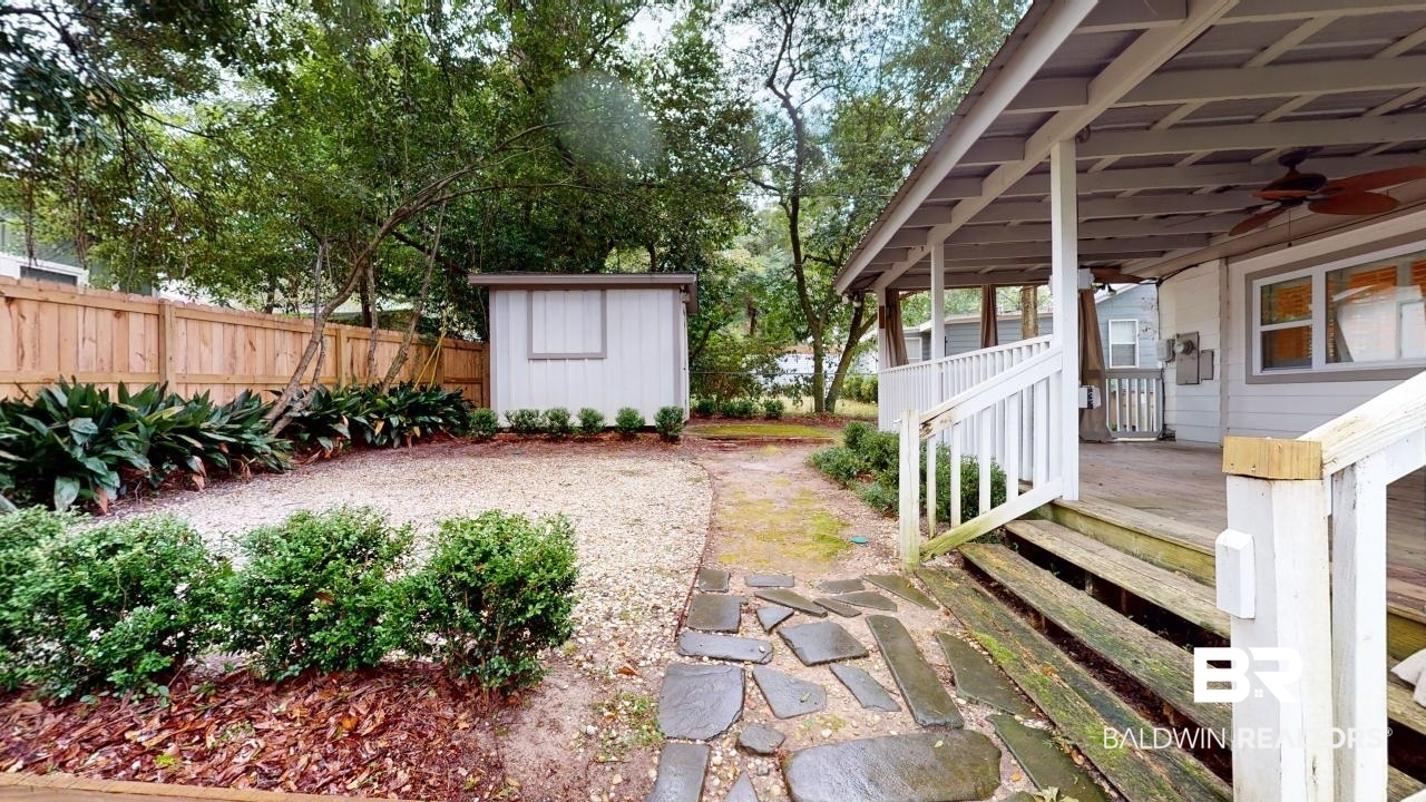 48 Hathaway Road West Mobile, AL 36608 - Photo 34 of 40 View of yard with ceiling fan and a shed