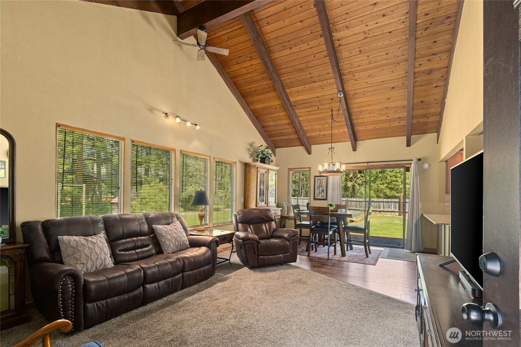 61 Lake Cabins Road Ronald, WA 98940 - Photo 4 of 29 a living room with furniture a flat screen tv and floor to ceiling window