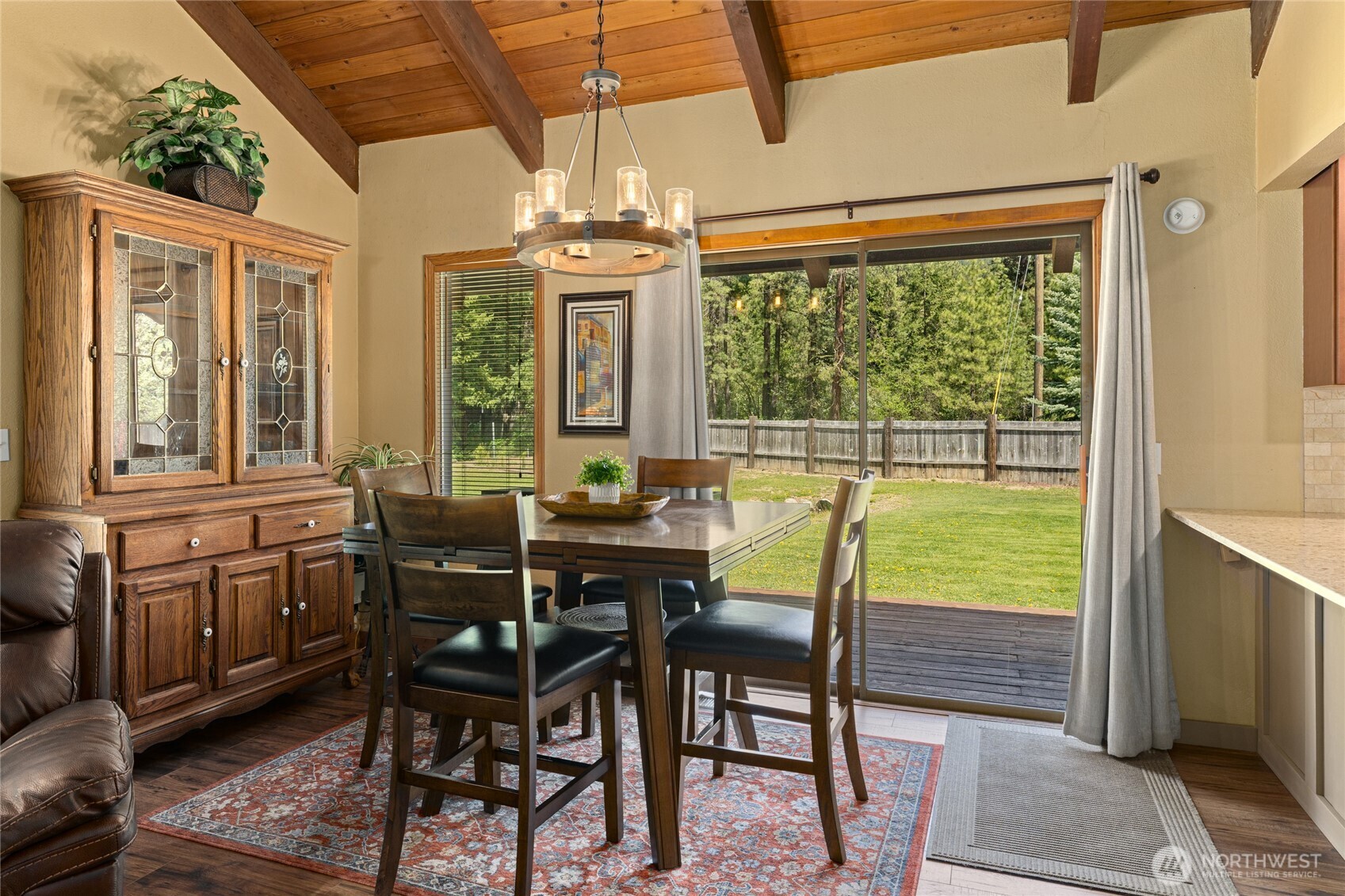 61 Lake Cabins Road Ronald, WA 98940 - Photo 6 of 29 a view of a dining room with furniture a chandelier and wooden floor