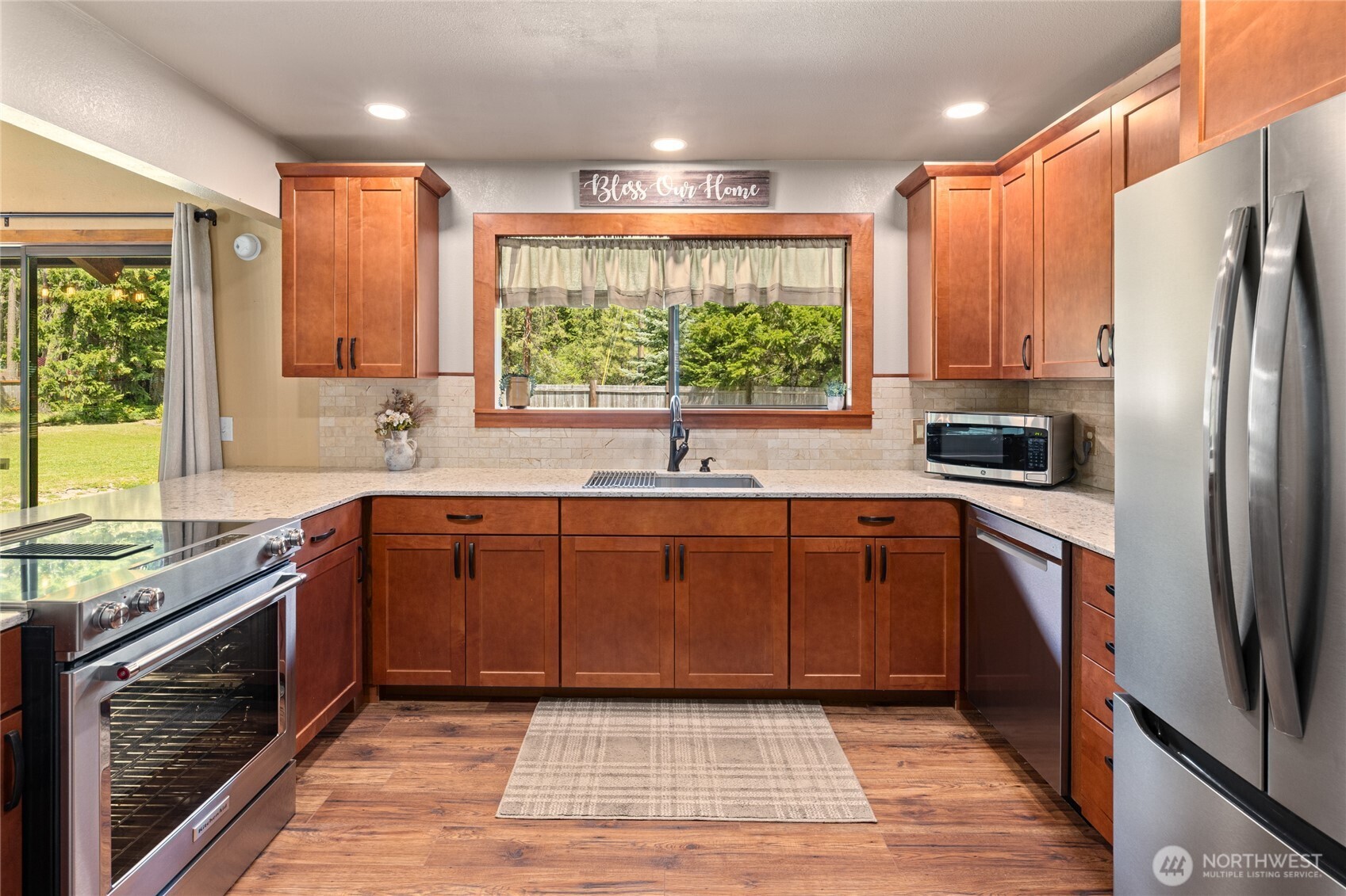 61 Lake Cabins Road Ronald, WA 98940 - Photo 8 of 29 a kitchen with stainless steel appliances granite countertop a refrigerator sink and wooden cabinets