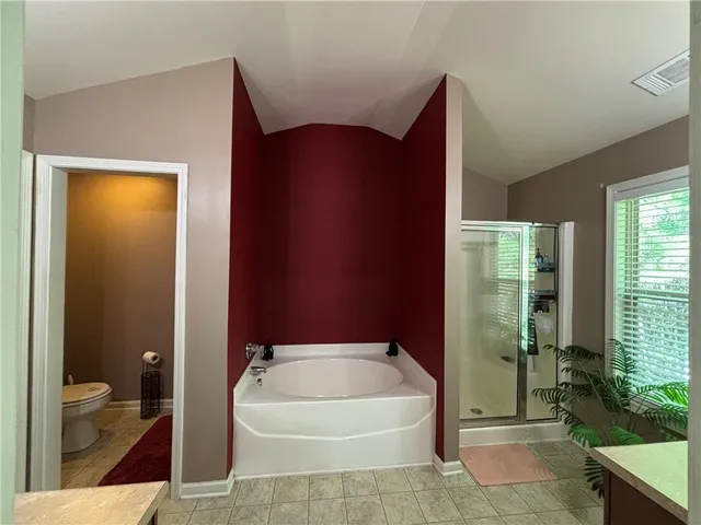 a bathroom with a bathtub and shower