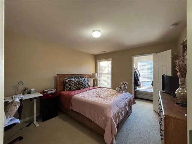 a bedroom with a bed and furniture