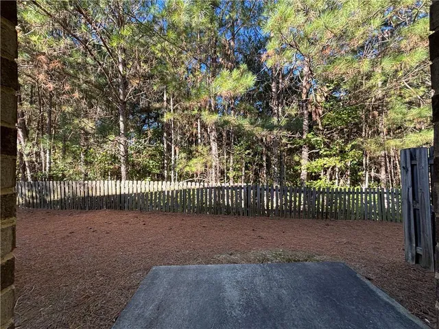 a view of a park with a large trees