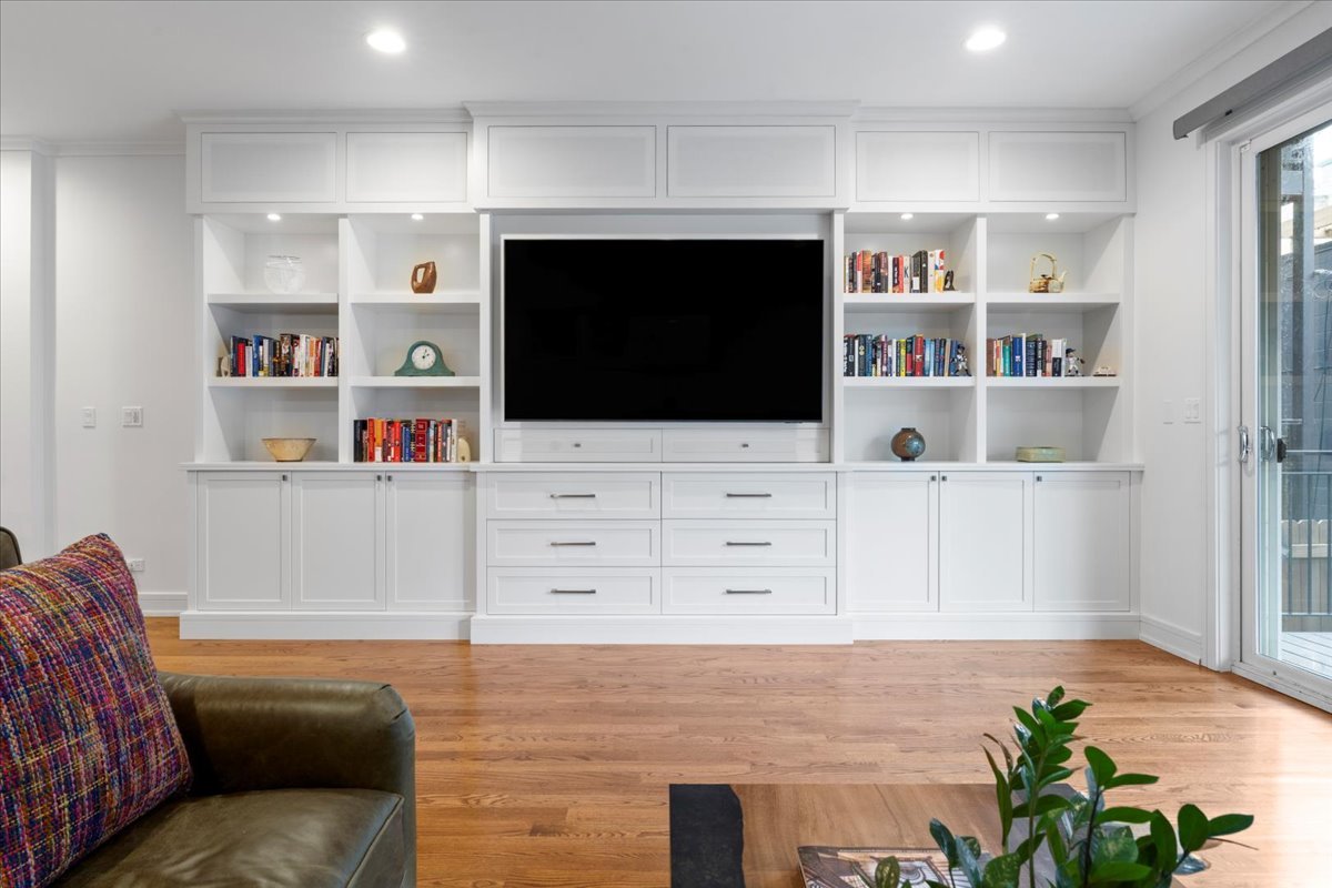 1515 North Mohawk Street, Unit 1 Chicago, IL 60610 - Photo 14 of 34 a living room with furniture and a flat screen tv