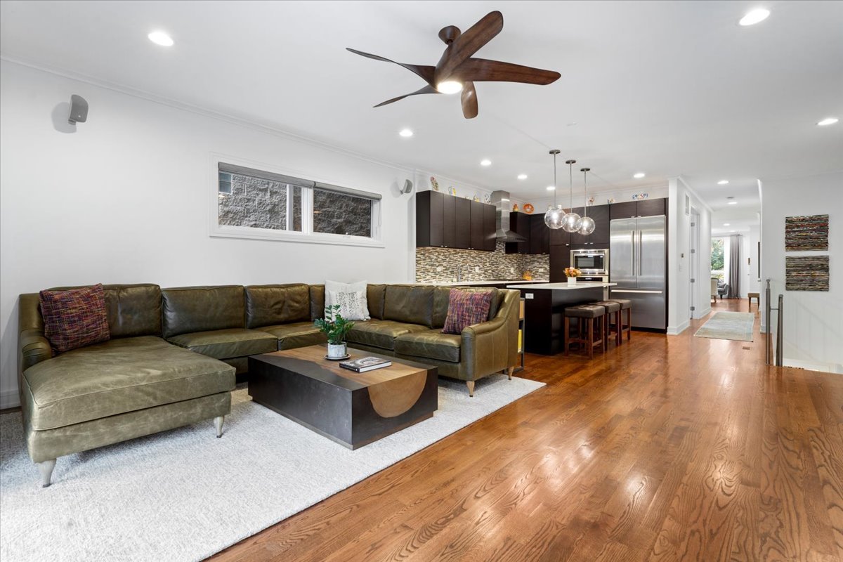 1515 North Mohawk Street, Unit 1 Chicago, IL 60610 - Photo 15 of 34 a living room with furniture kitchen view and a wooden floor