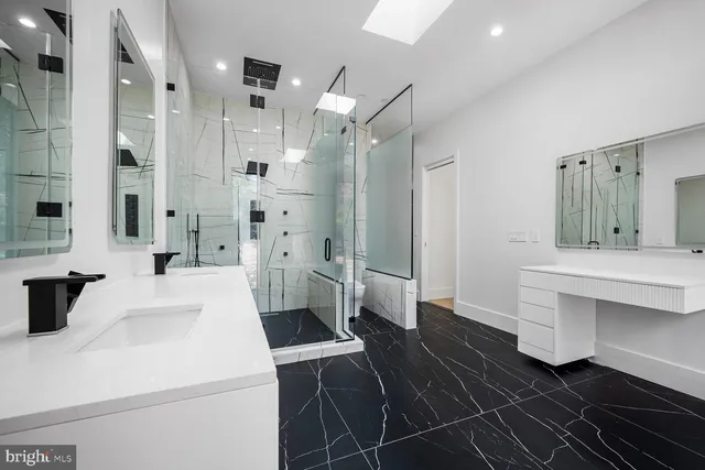 a room with a sink and a mirror