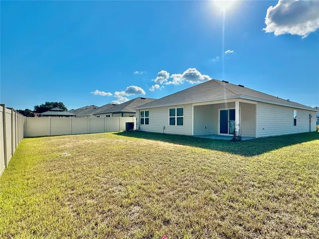 a house view with a backyard space