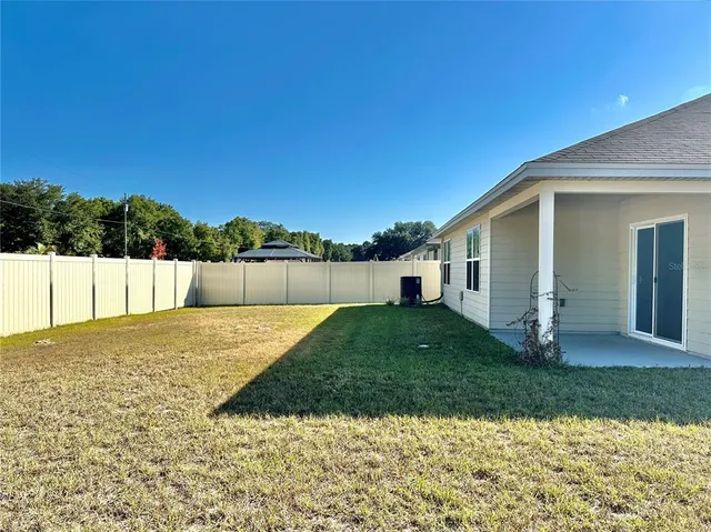 a view of a backyard of the house