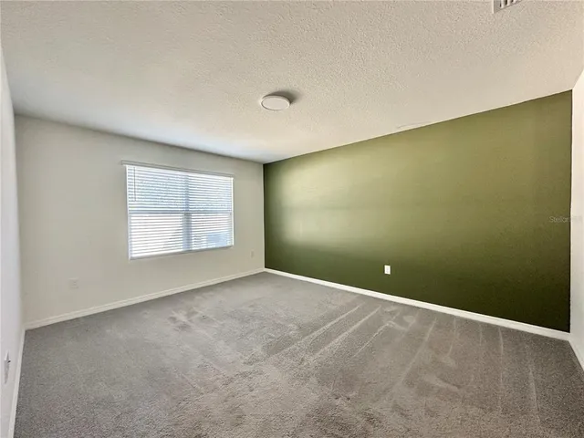 an empty room with a empty space and window