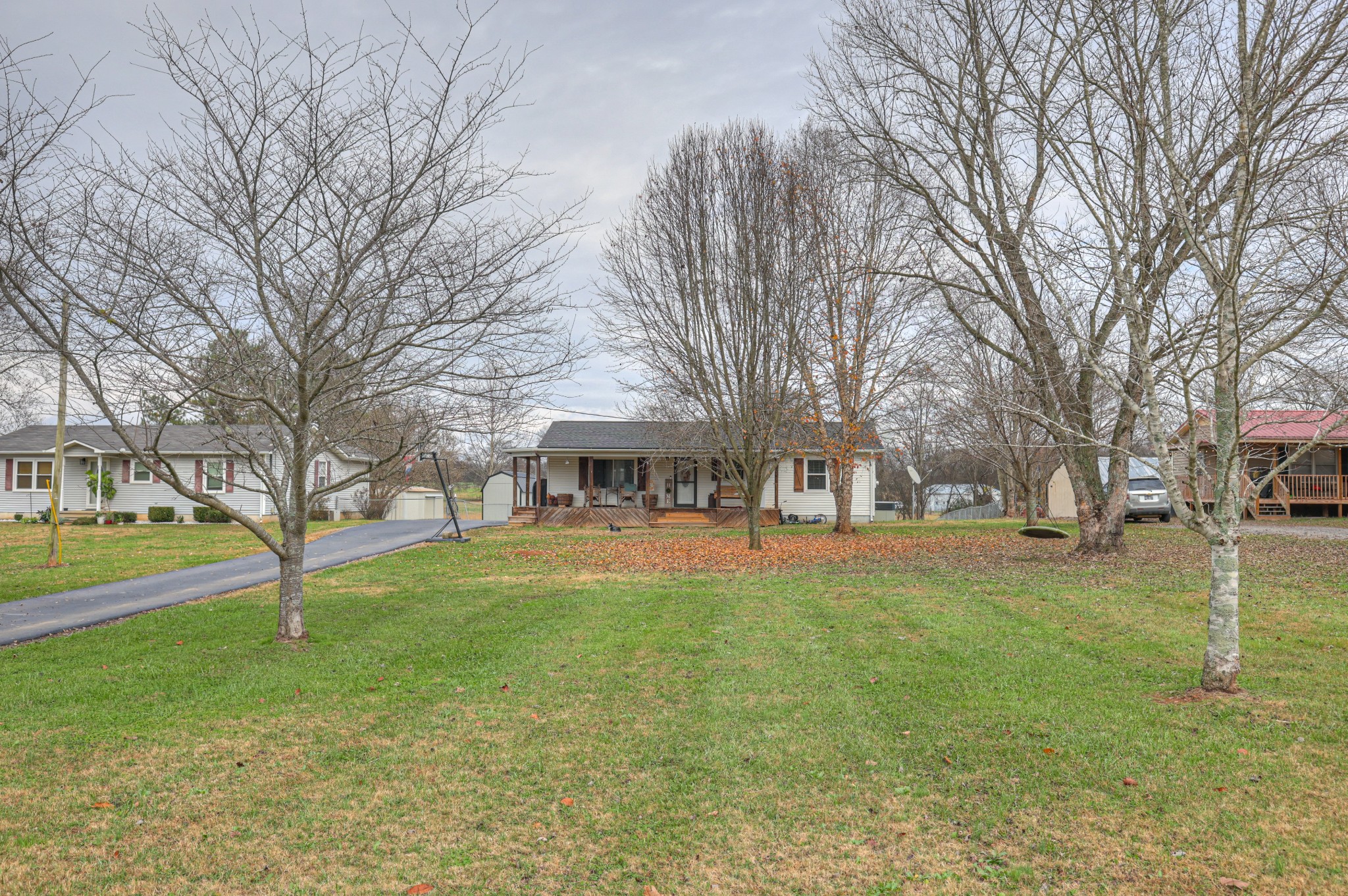 636 Warner Bridge Road Shelbyville, TN 37160 - Photo 1 of 32 a view of a yard with a house in the background